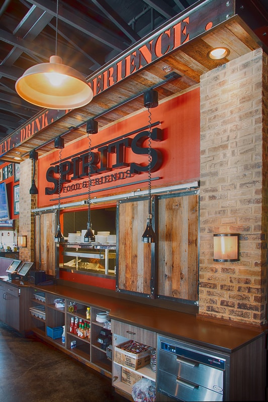 Spirits Food and Friends restaurant counter with rustic brick and reclaimed wood interior